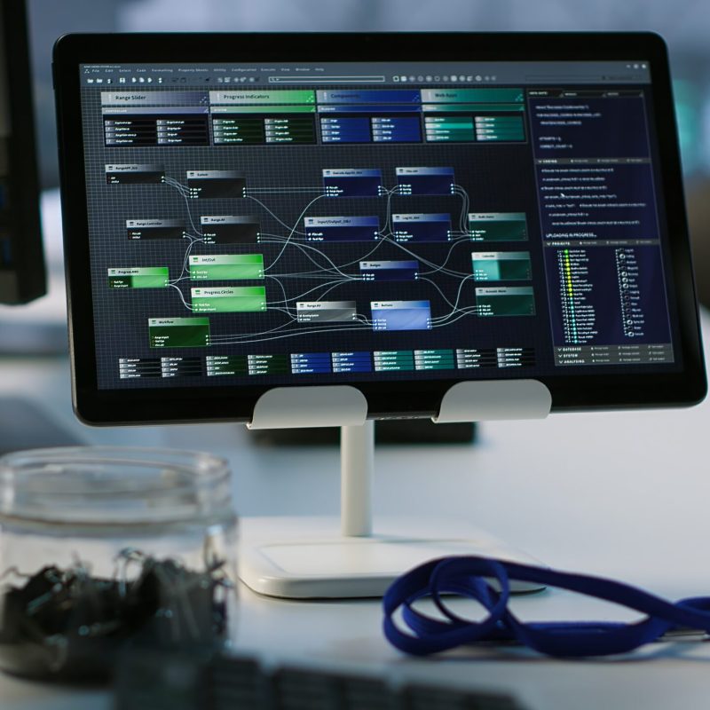 Close up of computer peripherals on server room desk used by employees working to ensure minimal downtime. Hard disk, keyboard and tablet in data center office used for monitoring performance